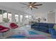 Open living room with backyard access and views of the kitchen and dining areas at 15421 S 16Th Dr, Phoenix, AZ 85045