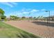 Community sand volleyball court with grass border at 15421 S 16Th Dr, Phoenix, AZ 85045