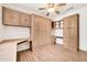 Bedroom showcasing built-in desks, cabinets, and drawers for ample storage and workspace at 15534 W Big Sky Dr, Surprise, AZ 85374