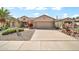 Charming single-Gathering home featuring desert landscaping, a two-car garage and lovely curb appeal at 15534 W Big Sky Dr, Surprise, AZ 85374