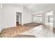 Spacious living area with light tile and carpet flooring and a window at 15534 W Big Sky Dr, Surprise, AZ 85374