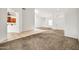 Bright and airy living spaces with tile floors and neutral carpeting at 15534 W Big Sky Dr, Surprise, AZ 85374