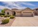 Inviting single-Gathering home featuring a three-car garage and well-maintained front yard at 1555 E Monterey St, Chandler, AZ 85225