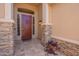 Charming entryway featuring a secure screen door and decorative stone accents at 1555 E Monterey St, Chandler, AZ 85225