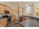 Well-equipped kitchen with stainless steel appliances and ample wood cabinetry at 1555 E Monterey St, Chandler, AZ 85225