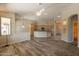 Open living space with kitchen access, a ceiling fan, and plenty of natural light at 1555 E Monterey St, Chandler, AZ 85225