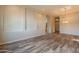 Spacious living area with neutral walls, archways, and wood-look tile flooring at 1555 E Monterey St, Chandler, AZ 85225