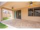 Large covered patio with tiled flooring, ceiling fans, and views of the backyard at 1555 E Monterey St, Chandler, AZ 85225