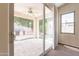 View from the bedroom out to a covered patio with a ceiling fan and outdoor kitchen at 1555 E Monterey St, Chandler, AZ 85225