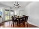 Dining room with table, chairs, and door to backyard at 161 S Maple St, Chandler, AZ 85226