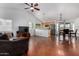 Open-concept living space with modern finishes, including a ceiling fan and stained concrete floors at 161 S Maple St, Chandler, AZ 85226