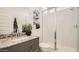 Modern bathroom with glass shower and granite countertops at 17345 W Smoketree Dr, Surprise, AZ 85387