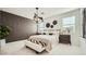 Modern bedroom with accent wall and elegant décor at 17345 W Smoketree Dr, Surprise, AZ 85387
