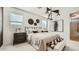 Beautifully decorated bedroom with accent lighting and art at 17345 W Smoketree Dr, Surprise, AZ 85387