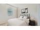 Clean bedroom with a modern bed frame and bright light at 17345 W Smoketree Dr, Surprise, AZ 85387