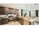 Well-equipped kitchen with granite countertops, stainless steel appliances, and ample storage at 17345 W Smoketree Dr, Surprise, AZ 85387