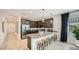 Stylish kitchen with granite countertops, stainless steel appliances, and breakfast bar at 17345 W Smoketree Dr, Surprise, AZ 85387