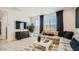 Relaxing living room features modern décor, ample seating, and a large sliding glass door at 17345 W Smoketree Dr, Surprise, AZ 85387