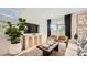 Cozy living room featuring neutral tones, modern decor, and ample natural light at 17345 W Smoketree Dr, Surprise, AZ 85387