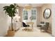 Stylish home office featuring neutral decor, a desk, chairs, and ample natural light perfect for a productive work space at 17348 W Smoketree Dr, Surprise, AZ 85387