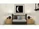 Charming Bedroom with a black crib, wooden side tables, and a whimsical moon-themed decor at 17403 W Swayback Pass, Surprise, AZ 85387