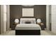 Cozy bedroom showcases a plush bed, neutral tones, decorative lamps and modern wall art at 17403 W Swayback Pass, Surprise, AZ 85387