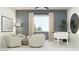 Bright living room with neutral furniture, a foosball table, and a window with natural light at 17403 W Swayback Pass, Surprise, AZ 85387