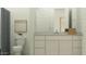 Well-lit bathroom featuring modern fixtures, a sleek vanity, and clean design at 17411 W Swayback Pass, Surprise, AZ 85387