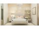 This cozy bedroom features a decorative wall finish, a built in desk and shelf, and neutral decor at 17411 W Swayback Pass, Surprise, AZ 85387