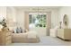 Inviting bedroom with neutral tones, soft bedding, and plenty of natural light at 17411 W Swayback Pass, Surprise, AZ 85387