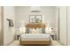 This minimalist bedroom has modern lighting, clean decor, and a cute wall-mounted giraffe at 17411 W Swayback Pass, Surprise, AZ 85387