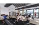 Modern gym with various fitness equipment and large windows overlooking the pool area at 17411 W Swayback Pass, Surprise, AZ 85387