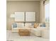 Inviting living room featuring a comfortable sectional sofa, stylish decor, and a cozy rug at 17411 W Swayback Pass, Surprise, AZ 85387