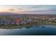 Beautiful homes near a serene lake with mountain views, offering a perfect blend of nature and community living at 18135 W Hope Dr, Goodyear, AZ 85338
