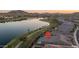 Gorgeous home with a backyard pool and a beautiful lake view, perfect for luxury living and relaxation at 18135 W Hope Dr, Goodyear, AZ 85338