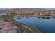 Picturesque lakefront home with lush greenery, offering a serene and luxurious lifestyle at 18135 W Hope Dr, Goodyear, AZ 85338