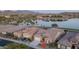 Beautiful lakefront property with manicured landscaping and tile roof, offering serene views and peaceful living at 18135 W Hope Dr, Goodyear, AZ 85338