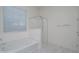 Bathroom showcasing a standalone shower and an oversized soaking tub at 18135 W Hope Dr, Goodyear, AZ 85338