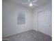 Simple bedroom with a ceiling fan, window, and closet at 18135 W Hope Dr, Goodyear, AZ 85338