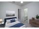 Modern bedroom showcases tasteful furniture, neutral decor, and a convenient en suite bathroom for a relaxing atmosphere at 18135 W Hope Dr, Goodyear, AZ 85338
