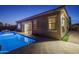 Back exterior featuring a luxurious pool and convenient access to the home at 18135 W Hope Dr, Goodyear, AZ 85338