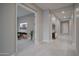 Hallway leading to office and bedrooms with neutral color palette at 18135 W Hope Dr, Goodyear, AZ 85338