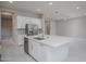 Open kitchen featuring a large island, stainless steel appliances, ample cabinet space, and modern design at 18135 W Hope Dr, Goodyear, AZ 85338