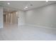 Spacious open living room with tile flooring and neutral color palette at 18135 W Hope Dr, Goodyear, AZ 85338