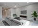 Modern living room with tile flooring, furniture and a ceiling fan at 18135 W Hope Dr, Goodyear, AZ 85338