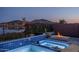 Backyard pool and spa with fire pit and lake views at 18135 W Hope Dr, Goodyear, AZ 85338