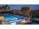 Sparkling pool featuring a fire pit with a view of the lake at 18135 W Hope Dr, Goodyear, AZ 85338
