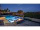 Backyard pool with spa, firepit and view of lake at 18135 W Hope Dr, Goodyear, AZ 85338