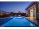 Stunning pool next to house, with an adjacent patio ideal for entertaining at 18135 W Hope Dr, Goodyear, AZ 85338