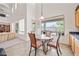 Bright dining area features a window view of the backyard and open floor plan at 19242 W Pasadena Ave, Litchfield Park, AZ 85340